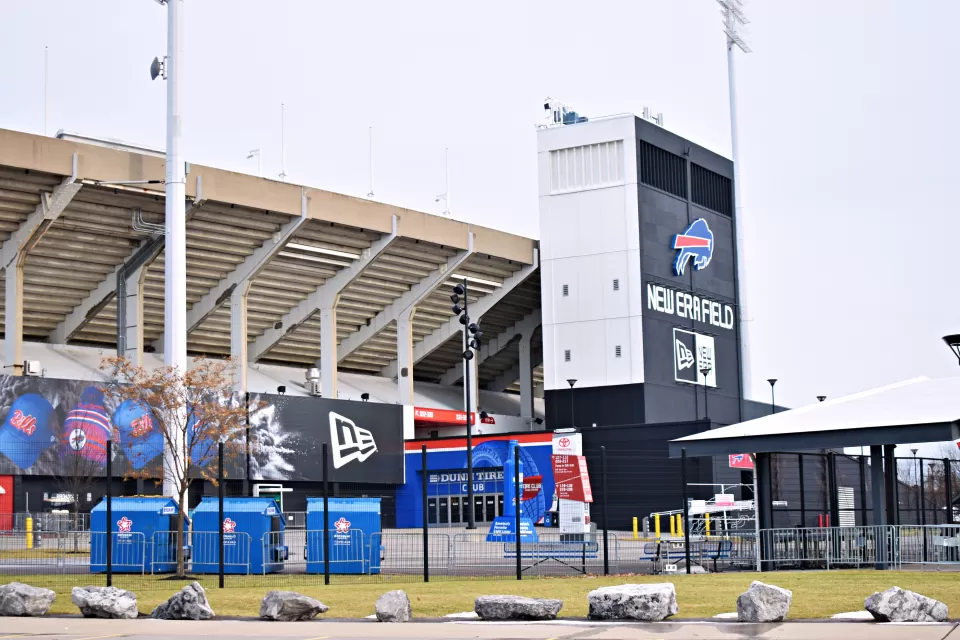 A football stadium, the home of the Buffalo Bills NFL team, is shown from the outside on a gloomy winter day.